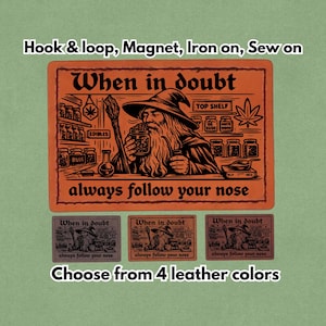 May include: Orange rectangular patch with a wizard illustration and the text "When in doubt always follow your nose." Below are three smaller patches in different colors. The text "Choose from 4 leather colors" is at the bottom. Options include hook & loop, magnet, iron-on, and sew-on.