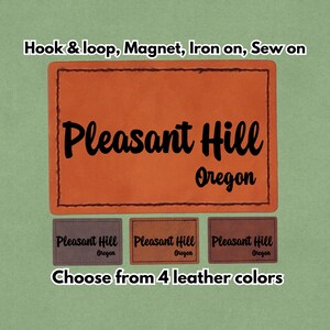 May include: Orange leather patch with the text "Pleasant Hill Oregon" in black script. The patch is available in four leather colors and can be attached with hook & loop, magnet, iron-on, or sewn on.