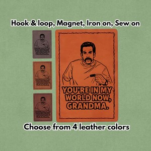 May include: Orange leather patch with a black illustration of a man and the text "YOU'RE IN MY WORLD NOW, GRANDMA." Smaller patches in brown, tan, and gray with the same design are also shown. The text "Hook & loop, Magnet, Iron on, Sew on" is at the top.