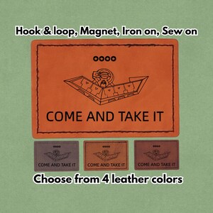 Könnte beinhalten: Orangenes Lederpatch mit schwarzer Grafik eines Raumschiffs und dem Text "COME AND TAKE IT". Das Bild zeigt auch drei kleinere Patches in verschiedenen Farben und den Text "Wählen Sie aus 4 Lederfarben."