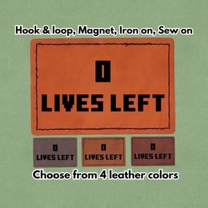 Puede incluir: Parche de cuero naranja con el texto "0 LIVES LEFT" en letras negras. La imagen también muestra tres parches más pequeños en diferentes colores con el mismo texto. El texto "Hook & loop, Magnet, Iron on, Sew on" está en la parte superior.