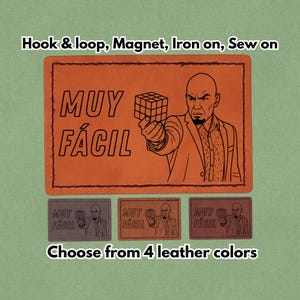 May include: Orange leather patch with a graphic of a man holding a Rubik's Cube, the words "MUY FÁCIL" are above the image. Below are three smaller patches in different colors. Text at the top says "Hook & loop, Magnet, Iron on, Sew on".