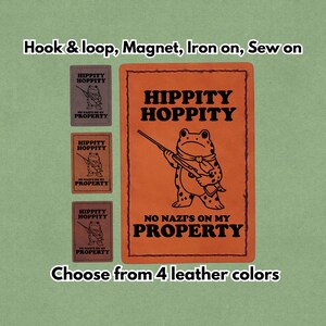 May include: An orange rectangular patch with the words "HIPPITY HOPPITY" and "NO NAZI'S ON MY PROPERTY" in black. A frog with a rifle is in the center. Three smaller patches are to the left. Text at the top says "Hook & loop, Magnet, Iron on, Sew on".