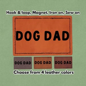 May include: An orange leather patch with the words "DOG DAD" in bold black letters. Below, three smaller patches in different shades of brown also read "DOG DAD". The text "Hook & loop, Magnet, Iron on, Sew on" is above the main patch.