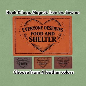 Könnte beinhalten: Orangenes Lederpatch mit dem Text "EVERYONE DESERVES FOOD AND SHELTER" in einem Herzdesign. Das Bild zeigt auch drei kleinere Patches in verschiedenen Farben und den Text "Choose from 4 leather colors".
