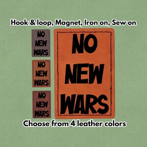 May include: An orange leather patch with the words "NO NEW WARS" in bold black letters. Three smaller patches with the same text are displayed to the left. The text "Choose from 4 leather colours" is also visible.