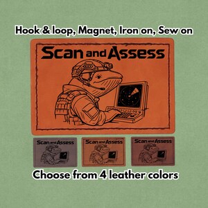 May include: Orange leather patch with the text "Scan and Assess" and an illustration of a whale in military gear using a computer. Includes options for hook & loop, magnet, iron-on, or sew-on. Available in 4 leather colors.