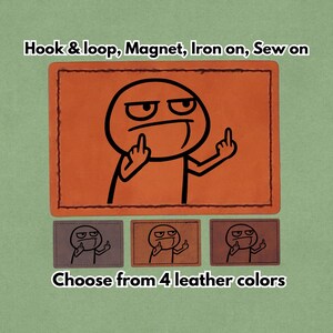 May include: Orange leather patch with a black cartoon figure giving the middle finger. The text "Hook & loop, Magnet, Iron on, Sew on" is above the patch. Below are three smaller patches and the text "Choose from 4 leather colors."