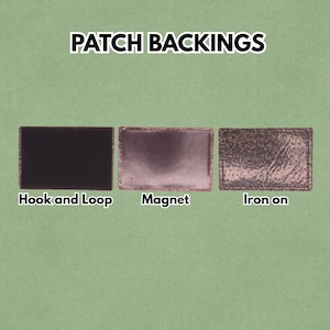 May include: Image showing three patch backing options: Hook and Loop, Magnet, and Iron-on. The Hook and Loop backing is black and textured. The Magnet backing is a metallic brown. The Iron-on backing has a distressed, textured appearance.