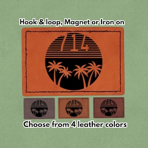 Può includere: Toppa in pelle arancione con un disegno nero di palme e il numero 714 all'interno di un cerchio. Il testo "Hook & loop, Magnet or Iron on" è in alto. Il testo "Choose from 4 leather colors" è in basso.