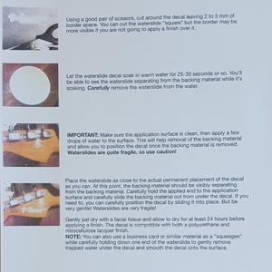 May include: A printed guide titled "HOW TO APPLY YOUR WATERSLIDE DECALS" with instructions and illustrations. The guide details cutting, soaking, applying, and drying waterslide decals. Includes a note about using a business card as a squeegee.