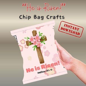 May include: A pink chip bag design with the text "He is Risen!" and "Chip Bag Crafts". The bag features a wooden cross adorned with pink flowers and green leaves. The words "Instant Download" are in a red stamp.