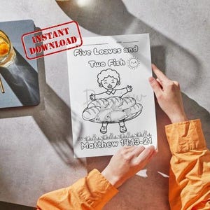 May include: Black and white printable colouring page with the text "Five Loaves and Two Fish" and "Matthew 14:13-21". The illustration depicts a smiling child holding a plate of bread and fish. A red "Instant Download" stamp is in the upper left corner.