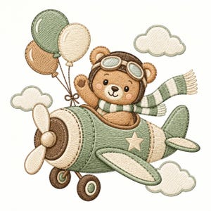 May include: An embroidered illustration of a brown teddy bear wearing a pilot hat with goggles and a green and white striped scarf, sitting in a green and cream airplane with a propeller, accompanied by three balloons and three clouds.