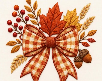 May include: An embroidery design featuring a central orange and white gingham bow surrounded by autumn elements including a large maple leaf, golden wheat stalks, small red berries on thin stems, and two brown acorns on a plain white fabric background.