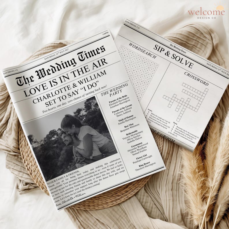 May include: Two wedding newspapers with the headline "The Wedding Times" and the text "Love is in the Air." One newspaper features a photo of a couple and wedding party details. The other has a crossword puzzle.