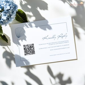 May include: A white wedding RSVP card with a seashell illustration and a QR code. The card includes the text "Kindly Reply" and instructions to RSVP via smartphone or website. A blue flower and shadows are in the background.