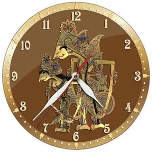 May include: Round wall clock with a brown face and gold-colored trim. The clock features a detailed, ornate design in the center, with gold and brown figures. The clock hands are white with red tips, and the numbers are in a gold tone.