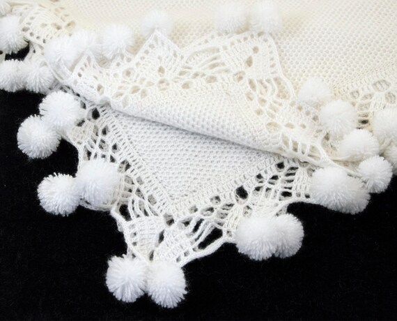 pom pom knitted baby blanket