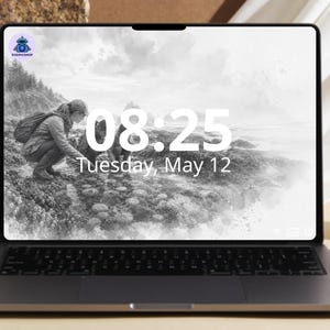 May include: A laptop displaying a grayscale image of a person near the ocean, with the time 08:25 and the date Tuesday, May 12. The laptop has a black keyboard and a silver frame. The logo "DIGISHOP" is in the top left corner.