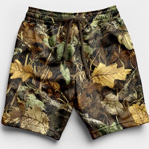 May include: Camouflage shorts with a drawstring waist. The shorts feature a pattern of brown, green, and yellow leaves and branches. The shorts are made of a soft material and are suitable for casual wear.