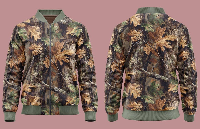 May include: A camouflage bomber jacket with a pattern of brown, green, and tan oak leaves and tree bark. The jacket has a green collar, cuffs, and hem, and a front zip. The back of the jacket is also visible.