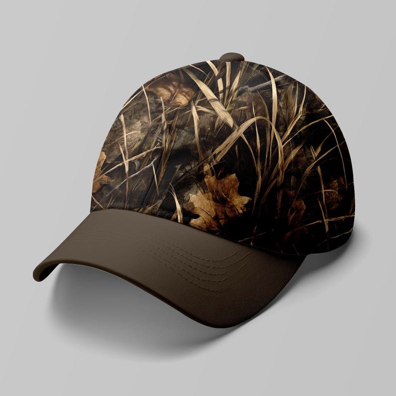 May include: A baseball cap with a camouflage pattern of brown, tan, and black, featuring a brown brim. The cap's design incorporates elements of dry grass and leaves, creating a naturalistic aesthetic.