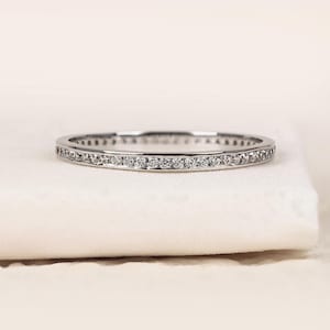 May include: A set of three ceramic mugs with a speckled, matte finish. Each mug features a different color: light blue, cream, and gray. The mugs have a simple, modern design and a comfortable handle.