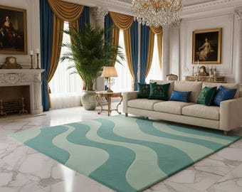 May include: A luxurious living room featuring a cream-colored sofa with decorative pillows, a large area rug with a wavy pattern in shades of teal and light green, and elegant gold and blue curtains. A chandelier hangs from the ornate ceiling.