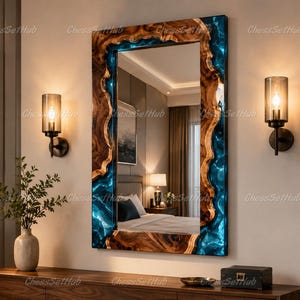 May include: A rectangular wall mirror featuring a natural wood frame with irregular, wavy edges and inlaid translucent blue resin. The mirror reflects a bedroom interior, and the frame displays distinct wood grain patterns and deep blue swirls.