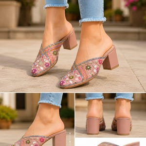May include: Pink embroidered mule heels with a 2-inch block heel. The open-back shoes feature floral embroidery in shades of pink, green, and orange. The upper is adorned with intricate stitching and embellishments, creating a stylish and elegant design.