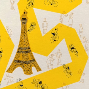 Close up detail shot of Tour Grand Tour cycling poster featuring a yellow winding race path on a neutral background, including fun illustrations of riders, spectators and the Eiffel Tower.