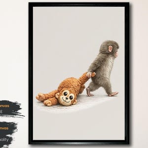 May include: A framed canvas print showing a baby monkey pulling a plush monkey toy. The print is in a black frame and has text that reads "Black Framed Canvas Ready to Hang" and "100% Cotton Canvas (300 g/m&sup2;) Premium Print Quality."