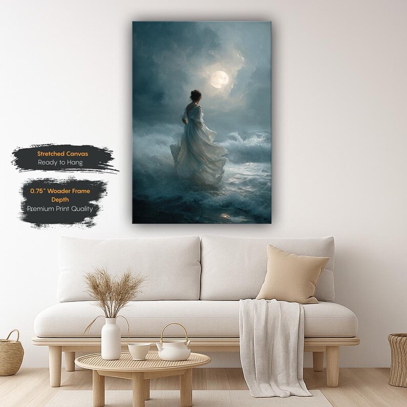 Op de afbeelding: Een canvas print toont een vrouw in een witte jurk in stormachtige oceaangolven onder een volle maan. Het kunstwerk is gespannen op een houten frame en klaar om op te hangen. Het canvas heeft een diepte van 1,9 cm en premium printkwaliteit.