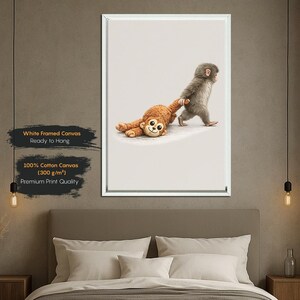 May include: A framed canvas print showing a gray monkey pulling a brown stuffed monkey. The print is on 100% cotton canvas and ready to hang. The text on the print reads "White Framed Canvas, Ready to Hang, 100% Cotton Canvas (300 g/m&sup2;), Premium Print Quality."