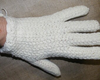 May include: White crocheted glove with a textured pattern.