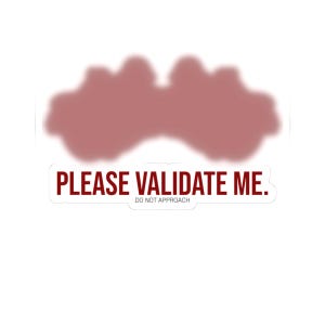 May include: A white sticker with the text "PLEASE VALIDATE ME." in a bold, dark red font. Below the text is "DO NOT APPROACH" in a smaller, dark red font. A blurred, reddish-brown shape is at the top.