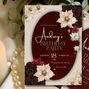 May include: Burgundy and cream birthday party invitation featuring floral accents. The invitation includes the text "Audrey's Birthday Party" with the date, time, and RSVP information. The design incorporates a floral border and decorative stars.