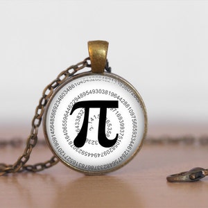 May include: A silver necklace with a round glass pendant featuring the mathematical constant pi (π) with the first 100 digits of pi displayed around the edge of the pendant.