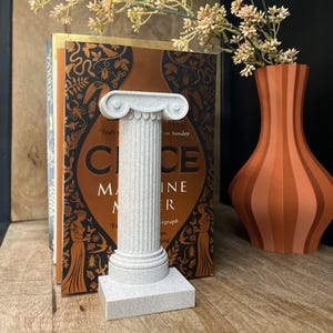 Sujetalibros de columna jónica griega: decoración de biblioteca de estilo clásico de mármol