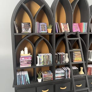 Gothic miniature library wall with glowing gold arches filled with miniature books, candles and vases, 1:12 dollhouse scale