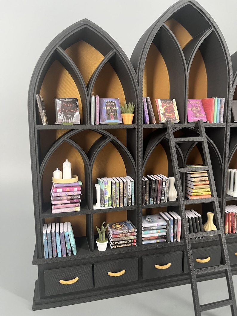 Gothic miniature library wall with glowing gold arches filled with miniature books, candles and vases, 1:12 dollhouse scale
