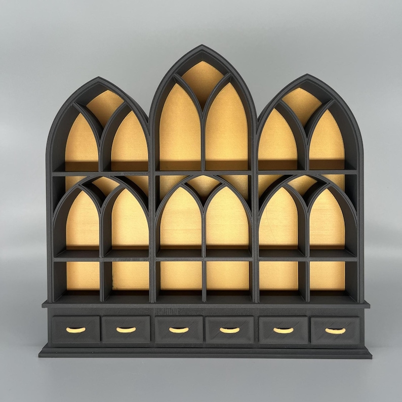 Black miniature bookcase set displayed empty on grey background.