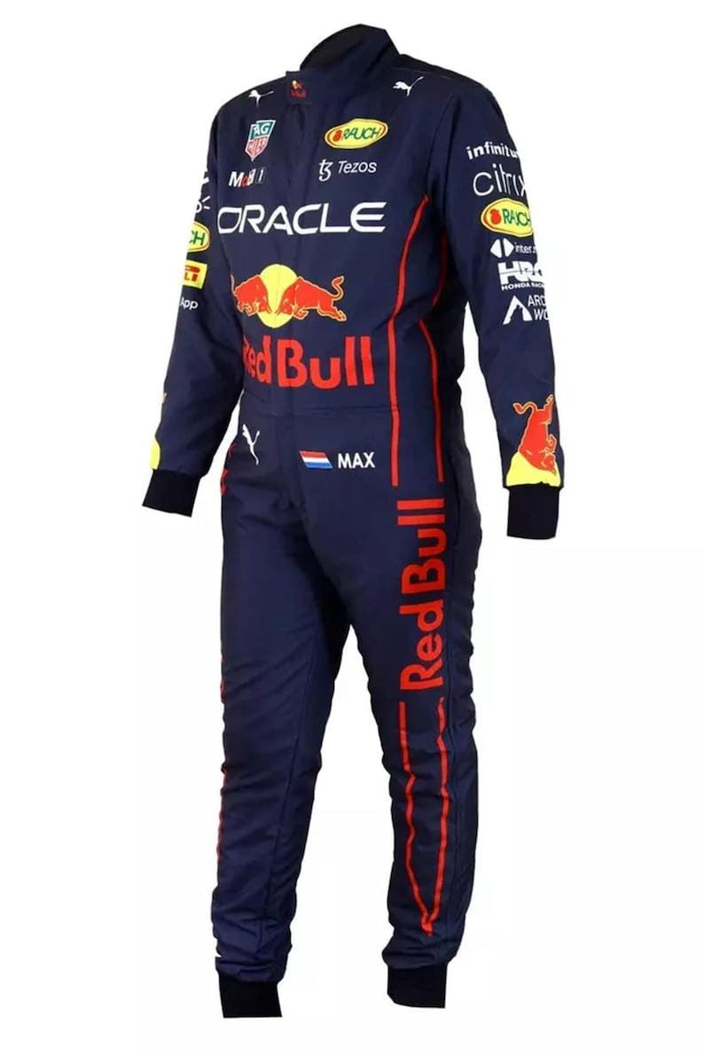 May include: Navy blue racing suit with red and white sponsor logos, including "Oracle" and "Red Bull." The suit features a full-body design with long sleeves and legs, and a Mandarin collar. The suit has a zipper closure and is designed for motorsports.