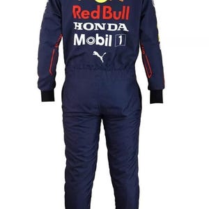 May include: Navy blue racing suit with the Red Bull, Honda, and Mobil 1 logos. The suit has black cuffs and trim, and the Oracle logo is visible on the back. The suit is a one-piece design.