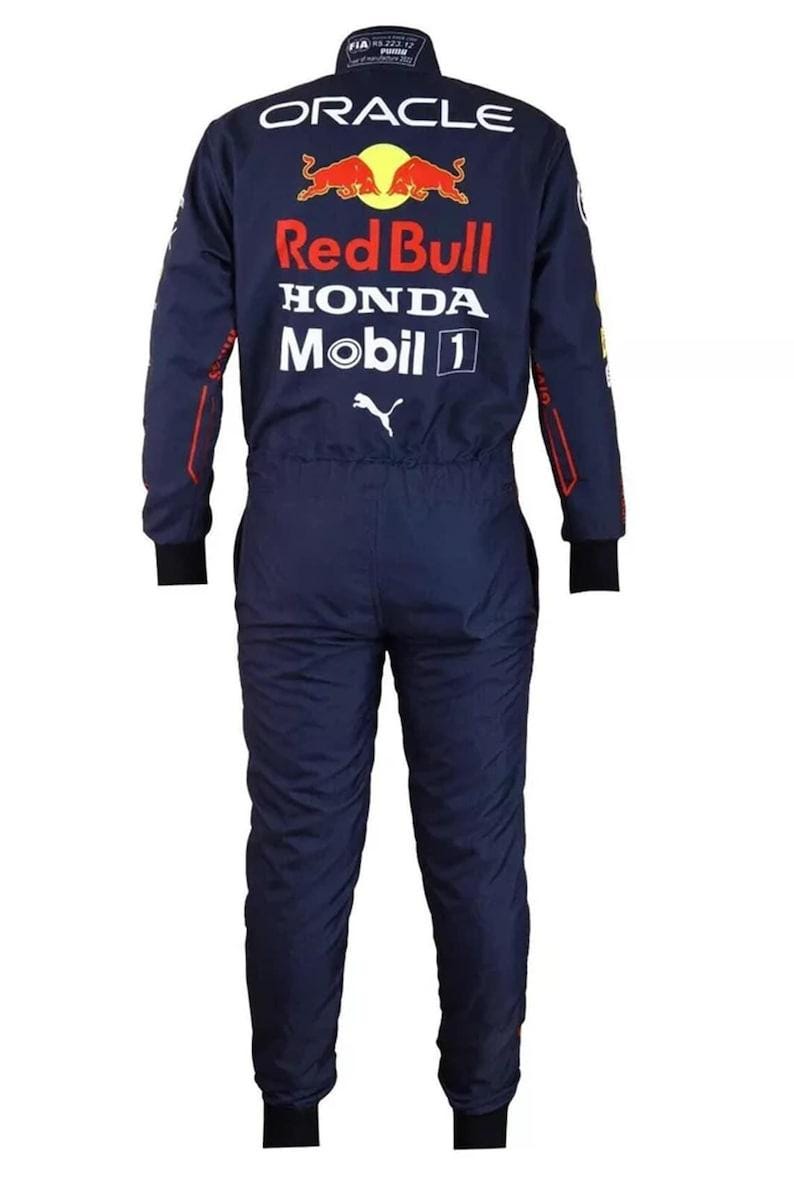 May include: Navy blue racing suit with the Red Bull, Honda, and Mobil 1 logos. The suit has black cuffs and trim, and the Oracle logo is visible on the back. The suit is a one-piece design.