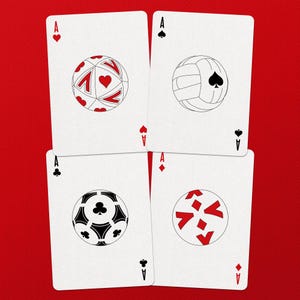 May include: Four playing cards, each featuring a white background and a red ace symbol. The cards display stylized sports ball designs: a soccer ball, a volleyball, a soccer ball, and a design with red shapes.