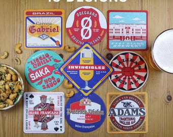 May include: A collection of beer coasters with various designs, including brewery logos and graphics. The coasters are square and round, with text that reads "18 Designs" and "Different Design on Each Side."