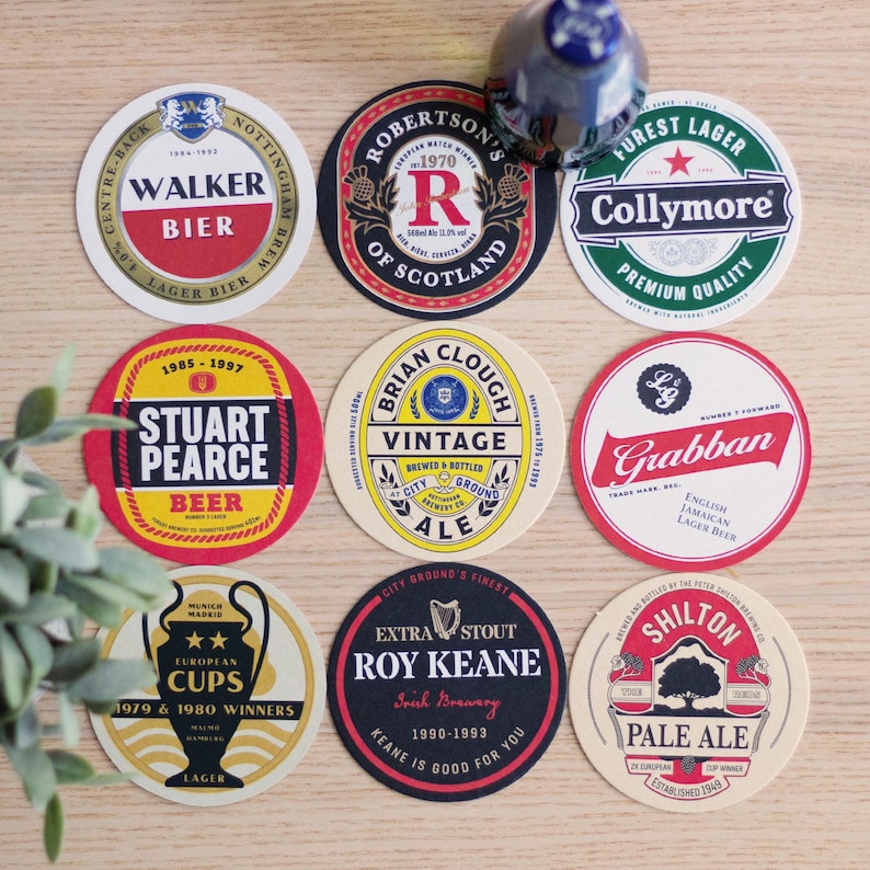 May include: Nine round beer coasters with various logos and text, including "Walker Bier," "Robertson's of Scotland," and "Collymore Forest Lager." The coasters feature a variety of colors and designs, perfect for a bar or home.