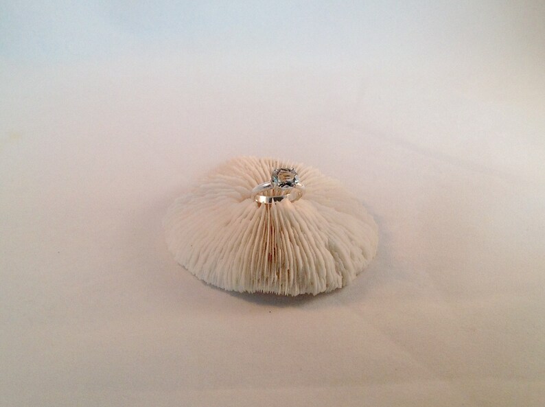 This oval green amethyst stone is set in solid sterling silver and is in a size 6.
